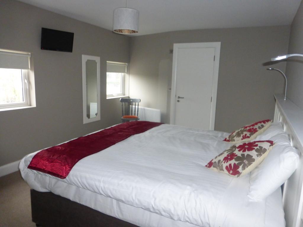 Ryan'S Hotel Конг Екстериор снимка